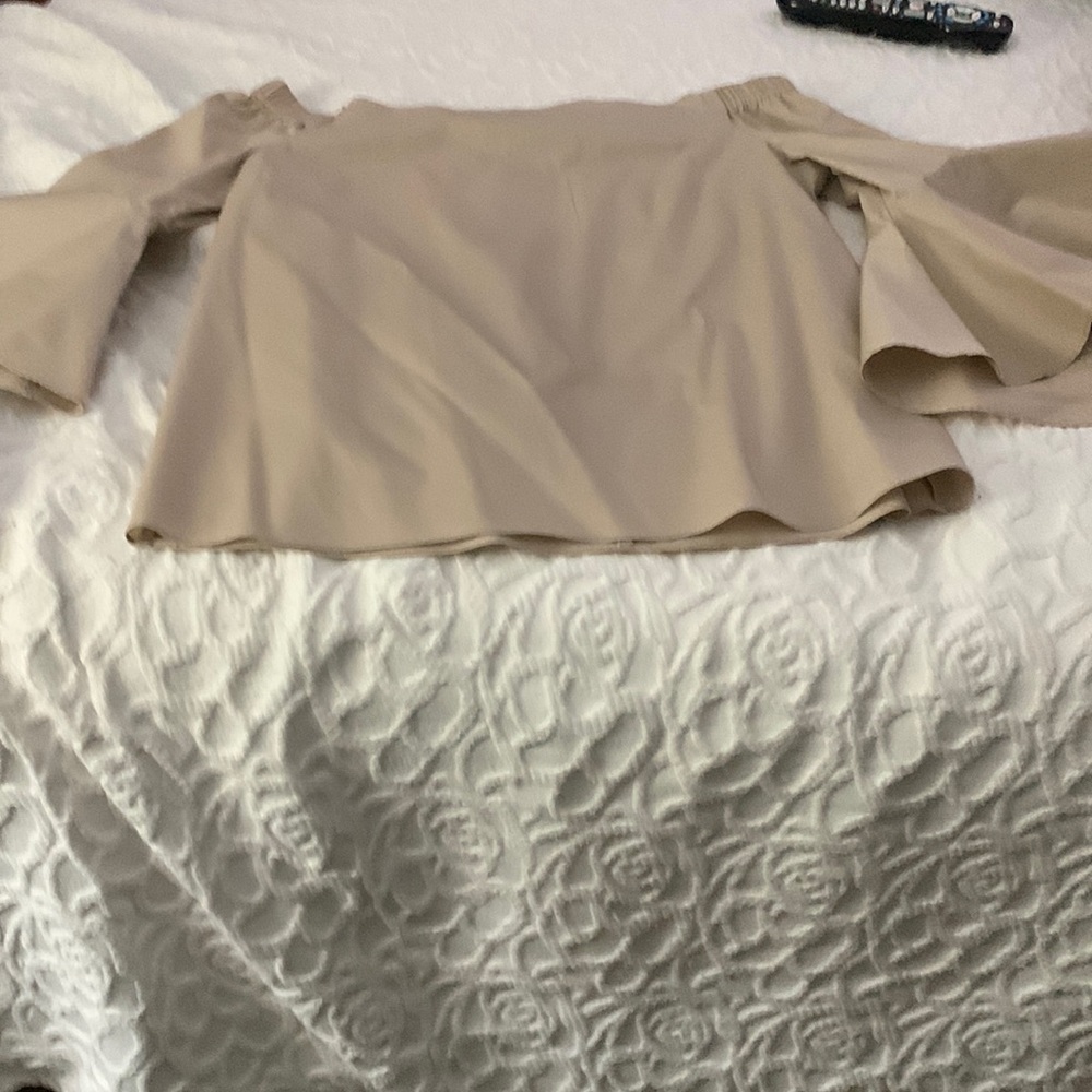 Jennifer Lopez off the shoulder bell sleeve shirt